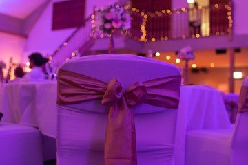 interior of  wedding party chair with ribbons
