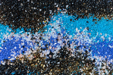 Layered colorful sand pattern. Marble style background. Blue and gold powder texture.