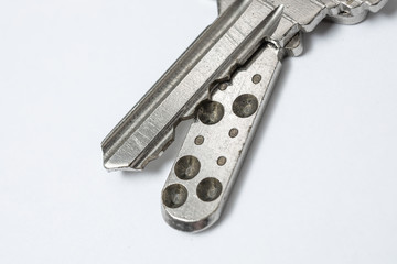 Close up of Silver key on white background
