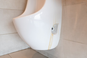 cracks on the urinal and surface stains