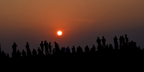 Fototapeta na wymiar sunset with people