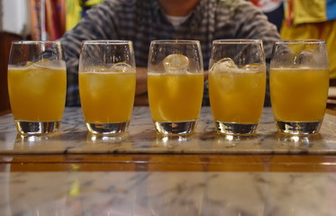 Glasses on the table with orange juice cocktail