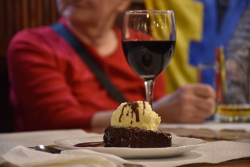 Cake and glass of wine on the table