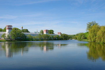 Fototapeta na wymiar Spring view of Novodevichy convent and Big Novodevichy pond in Moscow, Russia