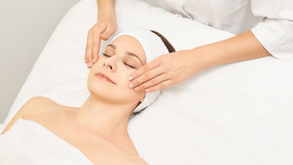 Face professional massage. Spa skincare treatment. Health facial masseur. Girl with doctor hands. Relax cosmetology procedure