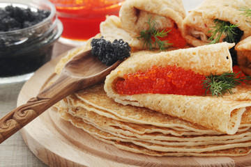 Russian pancakes with red and black caviar