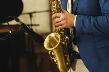 Obraz premium musician working on recording studio piano, sax, double bass, drum
