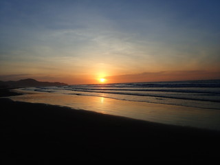 The beautiful and stunning sunset view along the seashore.