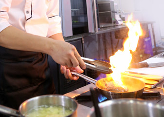 Chef cooking food in the kitchen, Chef preparing food