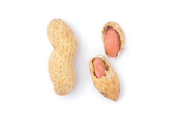 Close up of split peanuts in shell on white background. Healthy food, whole untreated nuts,...