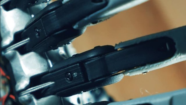 Close up of moving fingers of a cybernetic hand