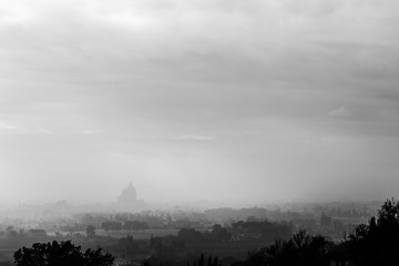Moody view of S.M. degli Angeli church (Assisi, Umbria, Italy) in the midst of autumn mist