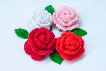 Obraz na płótnie Canvas Crochet roses with yarn for giving to those we love, Valentine's day.
