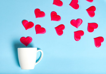 Valentine's Day, a cup of coffee and Valentine on a pink background, the concept of holiday and love
