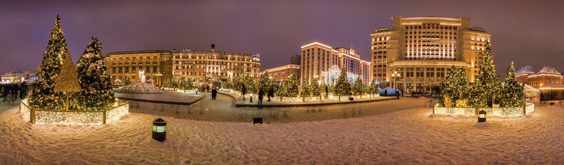 Fototapeta na wymiar Festive New Year Illumination on the Manezhnaya square near Red square and Kremlin, Moscow, Russia.