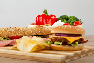 Sandwich, cheeseburger, salad and chips