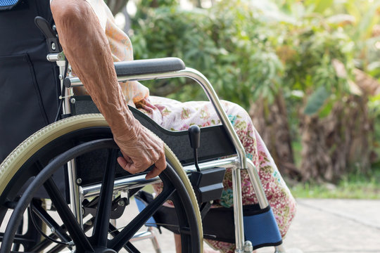 Asian Senior Or Elderly Old Lady Woman Patient On Wheelchair At The Front House,healthy Strong Medical Concept