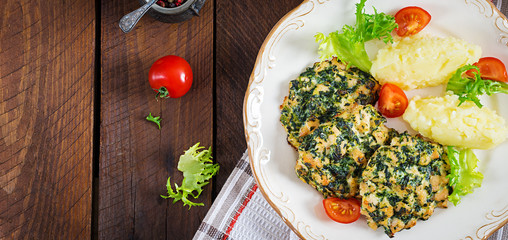 Baked steak chopped chicken fillet with spinach and a side dish of mashed potatoes. European cuisine. Dietary food. Top view