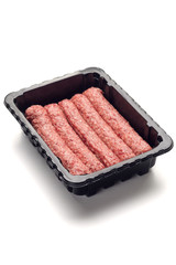 Packed raw sausages in black plastic black tray