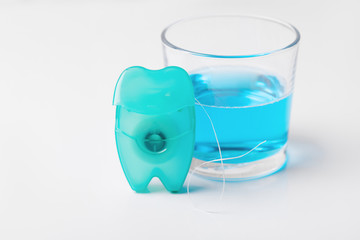 Dental floss on a blue background.