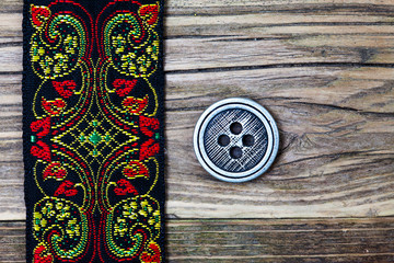 vintage band with embroidered ornaments and old button