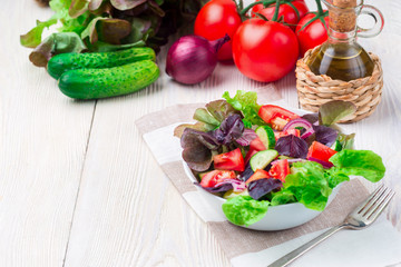 Healthy vegetable salad of fresh tomato, cucumber in bowl. Diet menu.