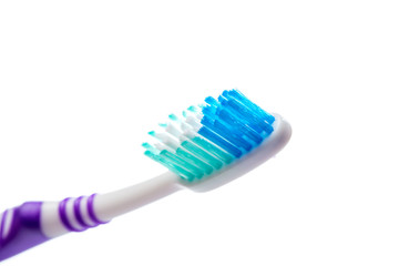 colored toothbrush on an isolated background, close up