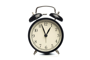 Black retro alarm clock on isolated background.