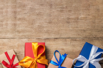 Many gift boxes on wooden background. Holiday concept, New Year, Christmas, Birthday, Valentine's...