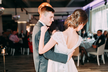 The first dance of a young couple. Wedding traditions in European style.