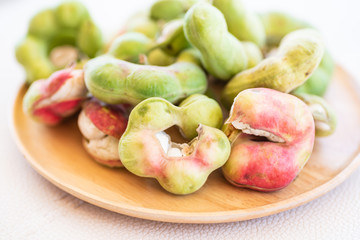 Manila tamarind fruit on wooden plate, Local Thai fruit