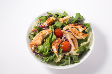 Grilled chicken and fresh vegetable salad