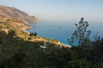 Viewpoint from a hiking trail near Lissos gorge to a coastline above Sougia bay at sunset, south-west coast of Crete island, Greece