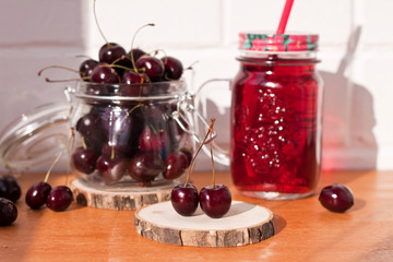 Homemade fresh cherry juice in a jar. Rustic style, healthy, organic, diet food. Selective focus.
