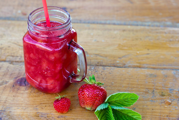 Strawberry smoothie in the glass jar. Summer,  healthy organic food concept.