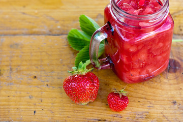 Strawberry smoothie in the glass jar. Summer,  healthy organic food concept.
