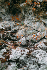 The bends of the river and the beautiful cliffs. Summer nature and texture of the stones with streaks.