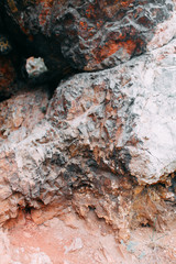 The bends of the river and the beautiful cliffs. Summer nature and texture of the stones with streaks.