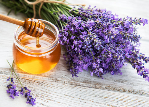 Jar with honey and fresh lavender