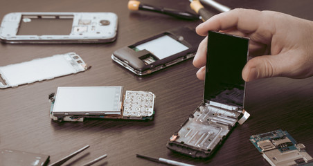 mobile phone repair, hands closeup