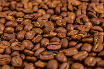 Background of many roasted coffee beans. Selective focus