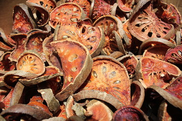 Dried bael fruit background. Close up dried herb. Many of slices of bael fruit .