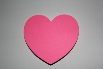 Valentines day card with sticky note in the shape of a heart