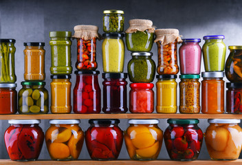 Jars with variety of pickled vegetables and fruits