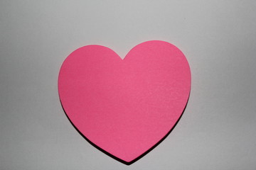 Valentines day card with sticky note in the shape of a heart