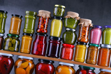 Jars with variety of pickled vegetables and fruits