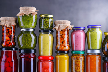 Jars with variety of pickled vegetables and fruits