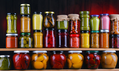 Jars with variety of pickled vegetables and fruits