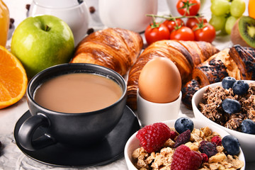 Breakfast served with coffee, juice, croissants and fruits