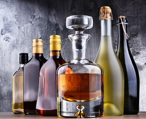 Carafe and bottles of assorted alcoholic beverages.
